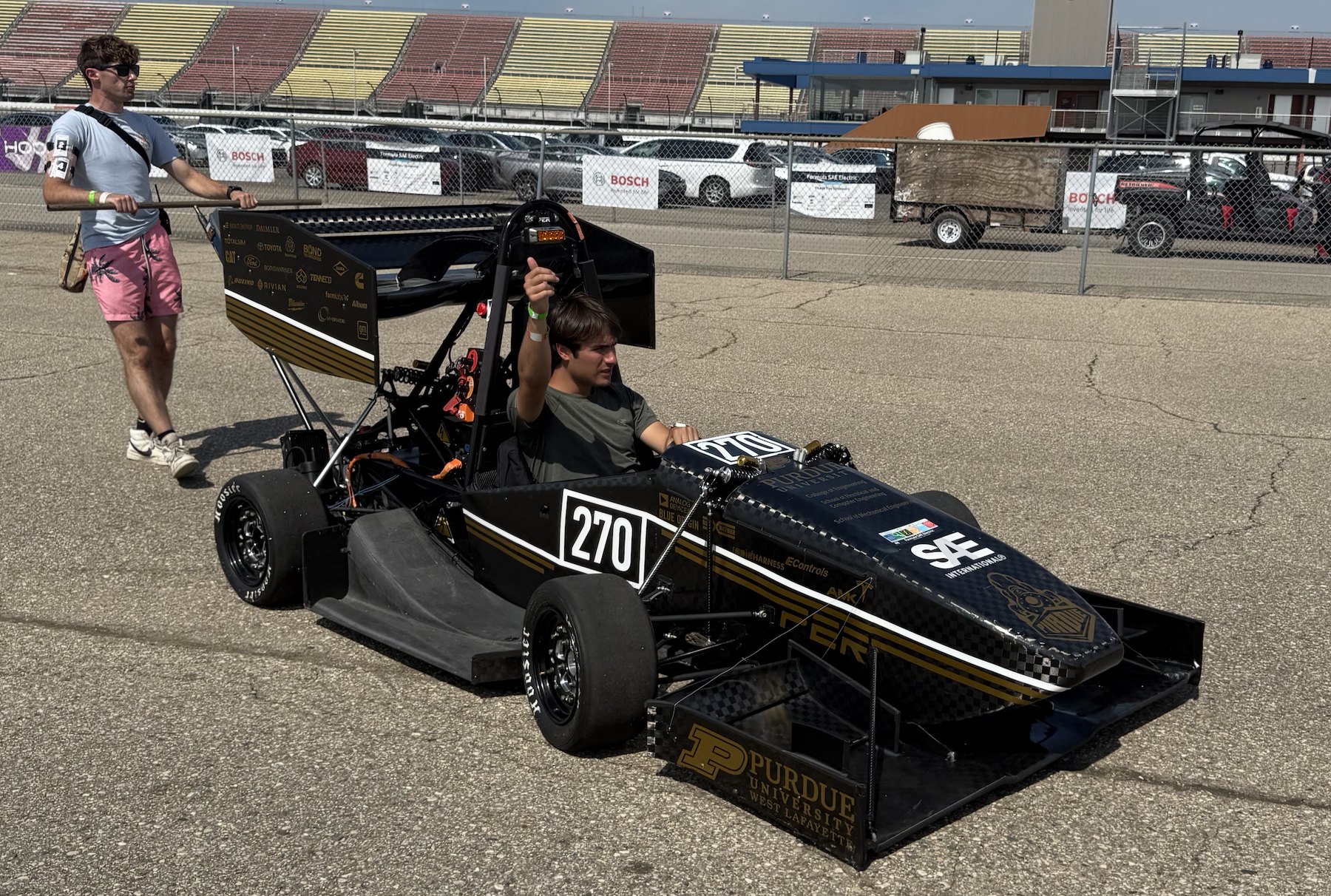 The 2025 car, number 270, being pushed through the paddock at competition
