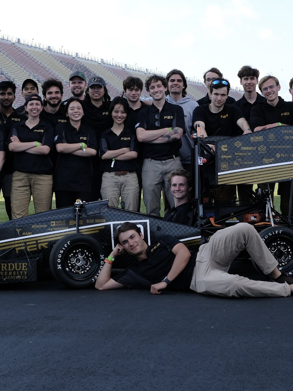 The 2025 Purdue Electric Racing team with their car at competition